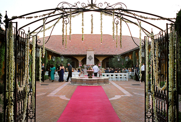 Southwestern ceremony site gate and fountain - wedding photo by Harrison Hurwitz Photography
